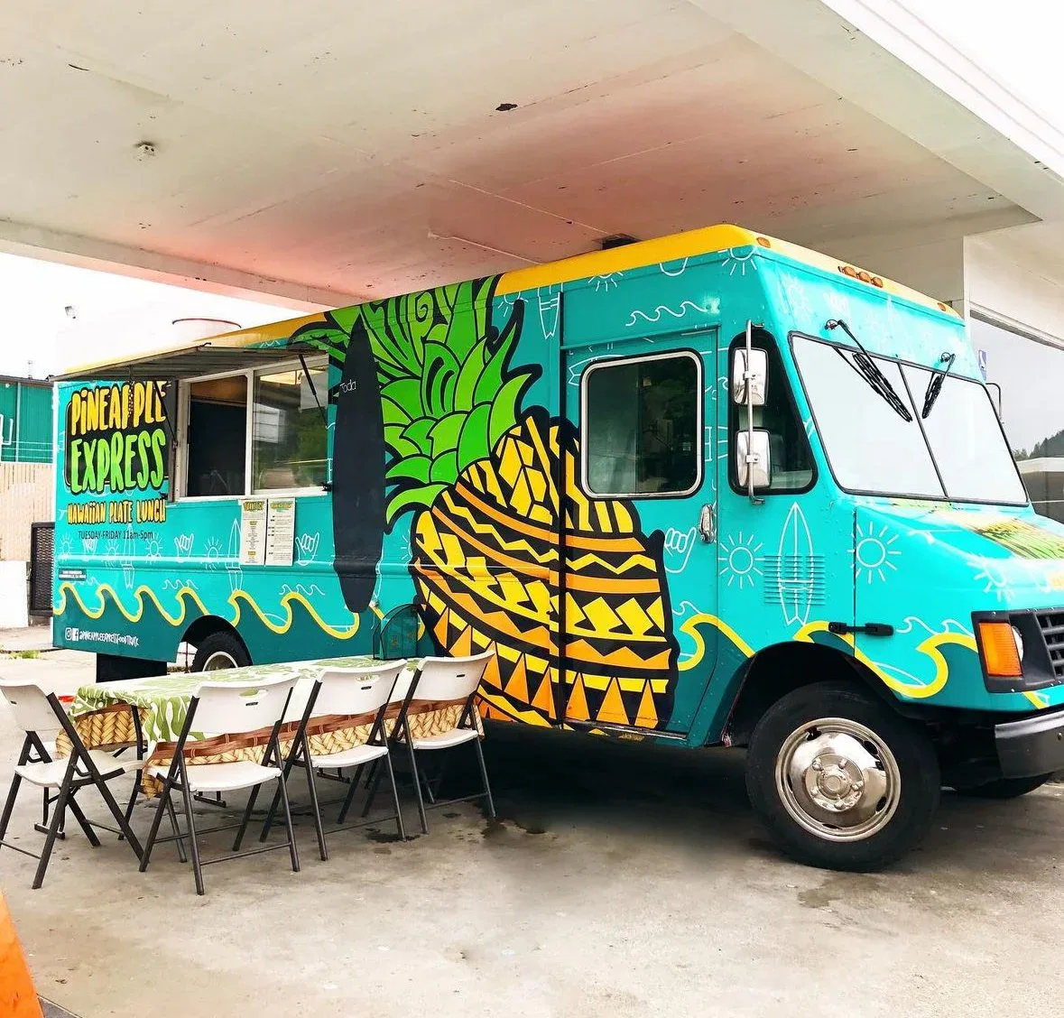 The Pineapple Express food truck parked at the Kreations Auto Body Fortuna shop