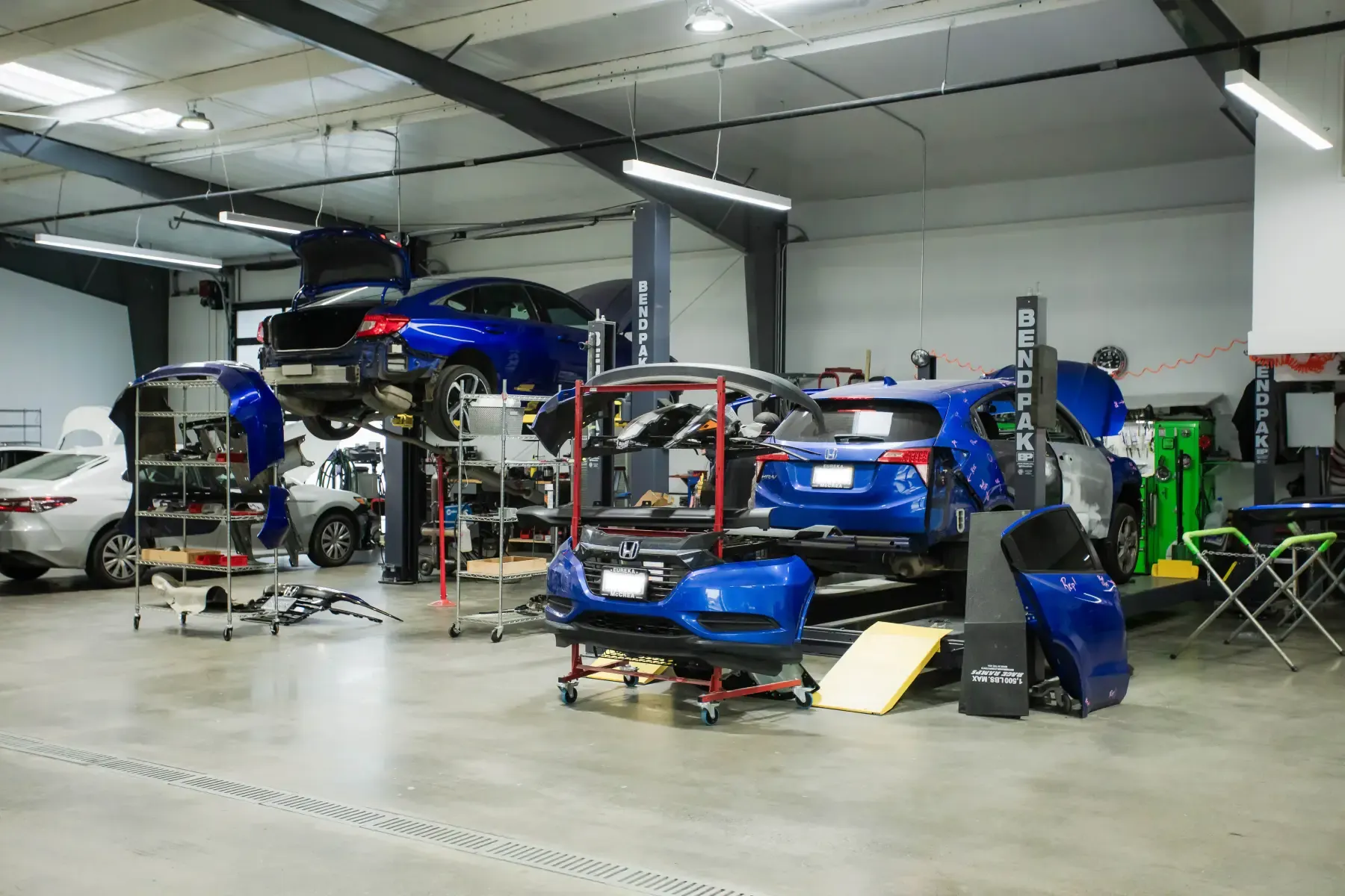 Collision repair bay at CARSTAR Kreations Auto Body, serving Willits and Mendocino County