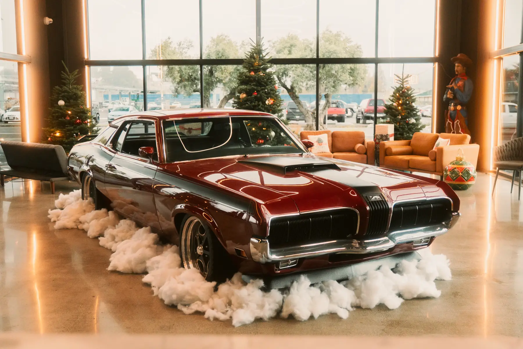 Red convertible in the Kreations Auto Body showroom